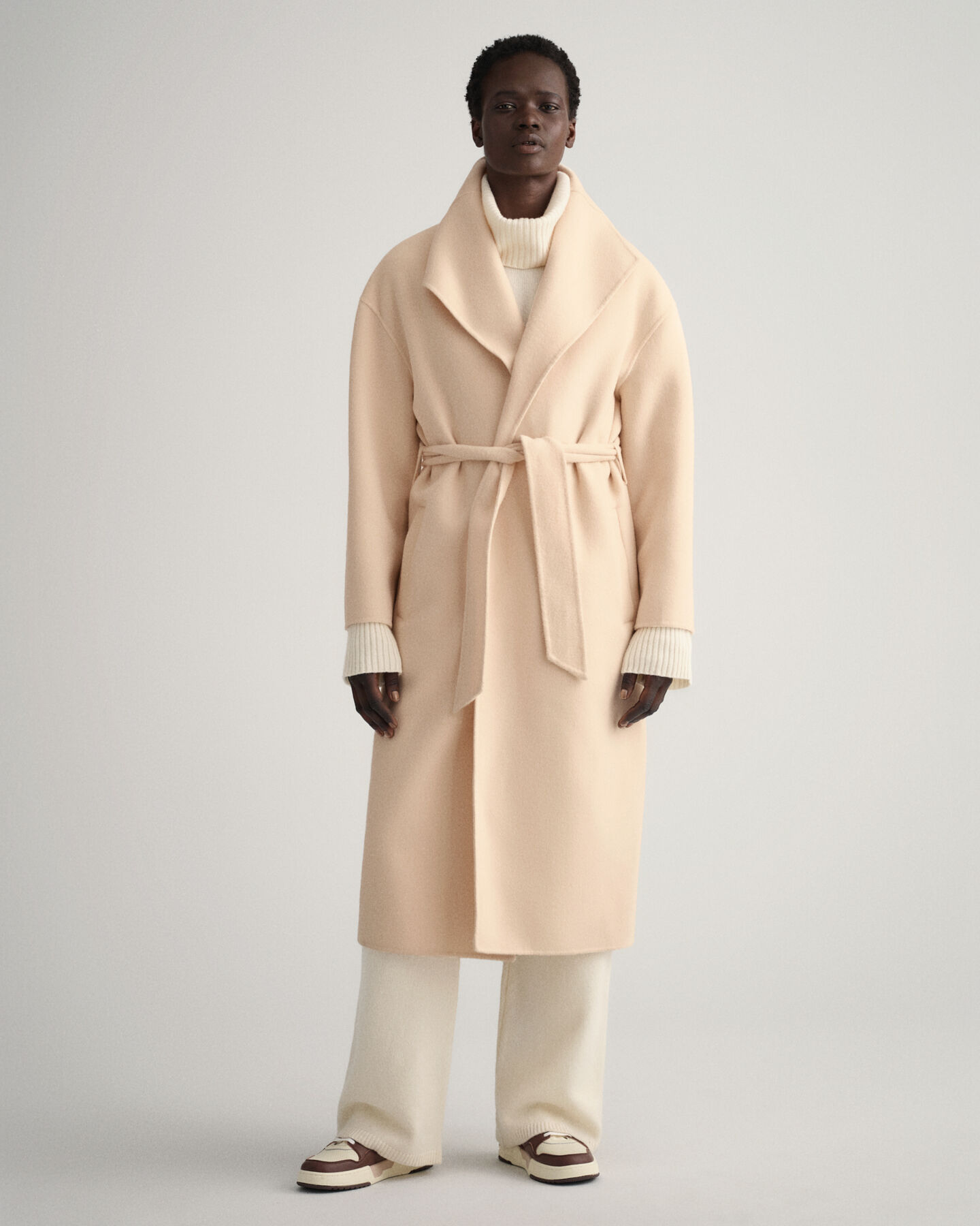 Manteau cousu main avec ceinture