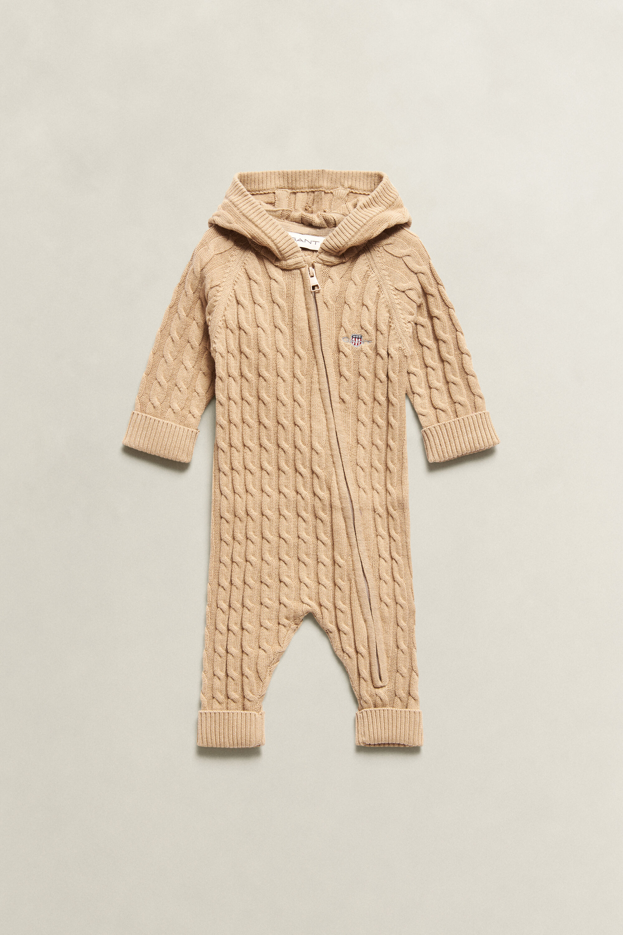 Combinaison en maille torsadée avec écusson Bébé