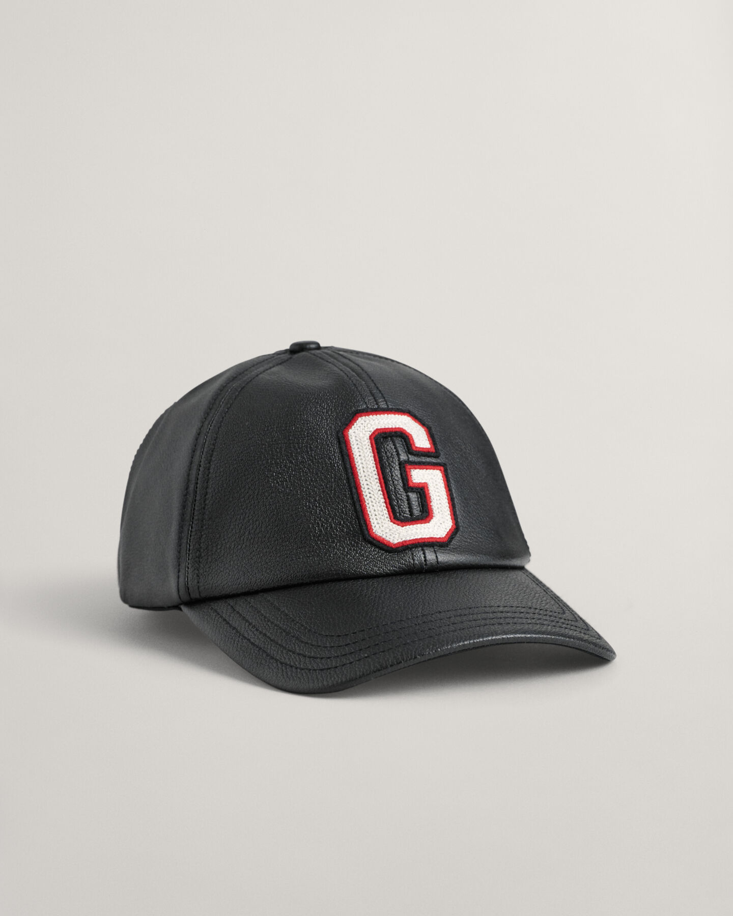 Casquette en cuir avec écusson G