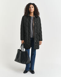 Manteau matelassé avec bord en velours côtelé