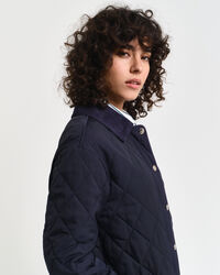 Manteau matelassé avec finitions en velours côtelé