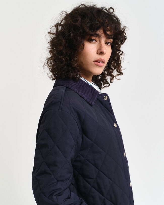 Manteau matelassé avec finitions en velours côtelé