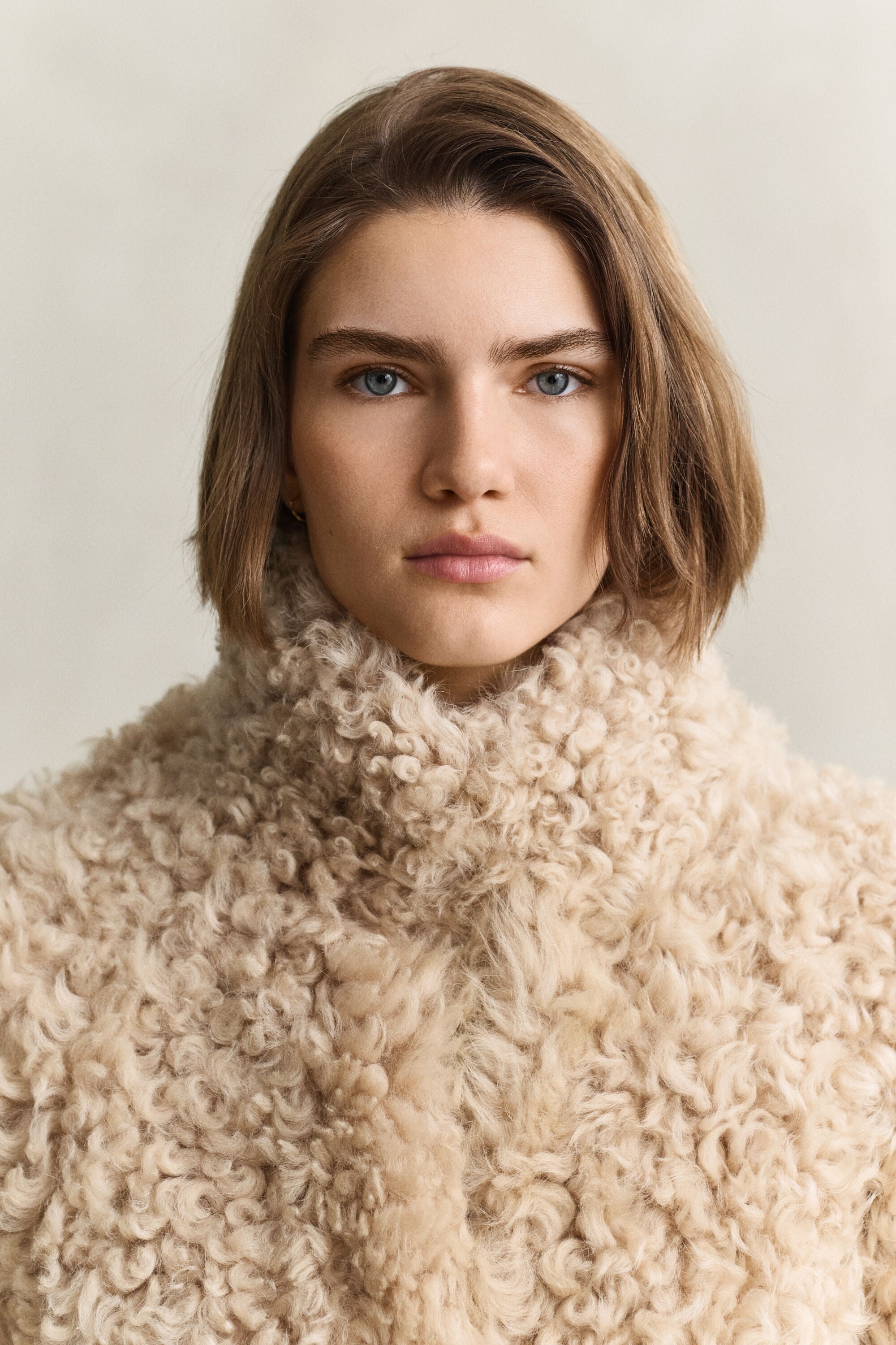 Manteau en peau lainée