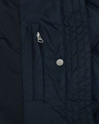 Manteau matelassé avec bord en velours côtelé