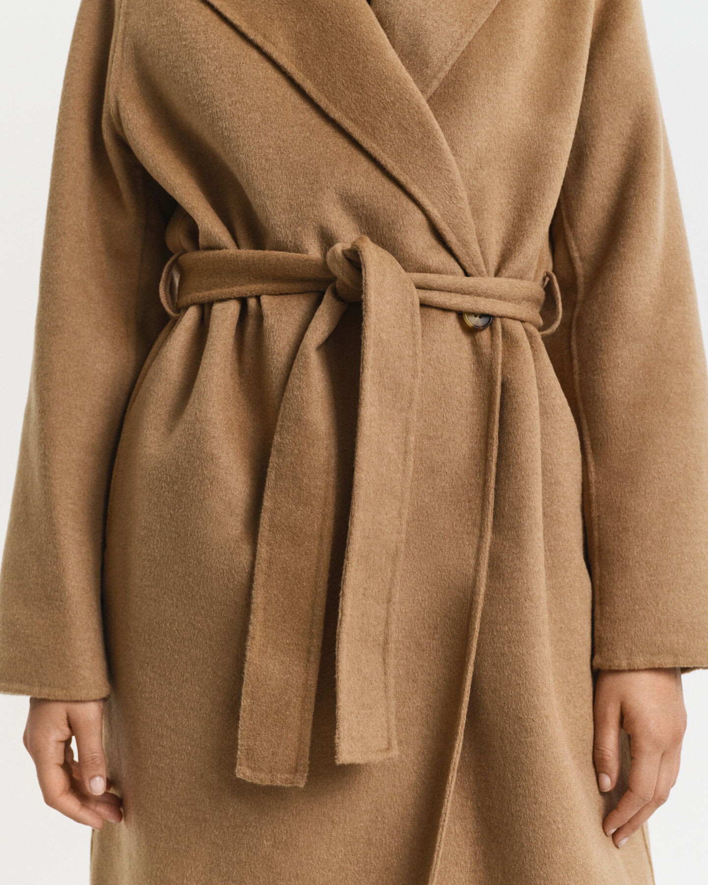 Manteau cousu main avec ceinture