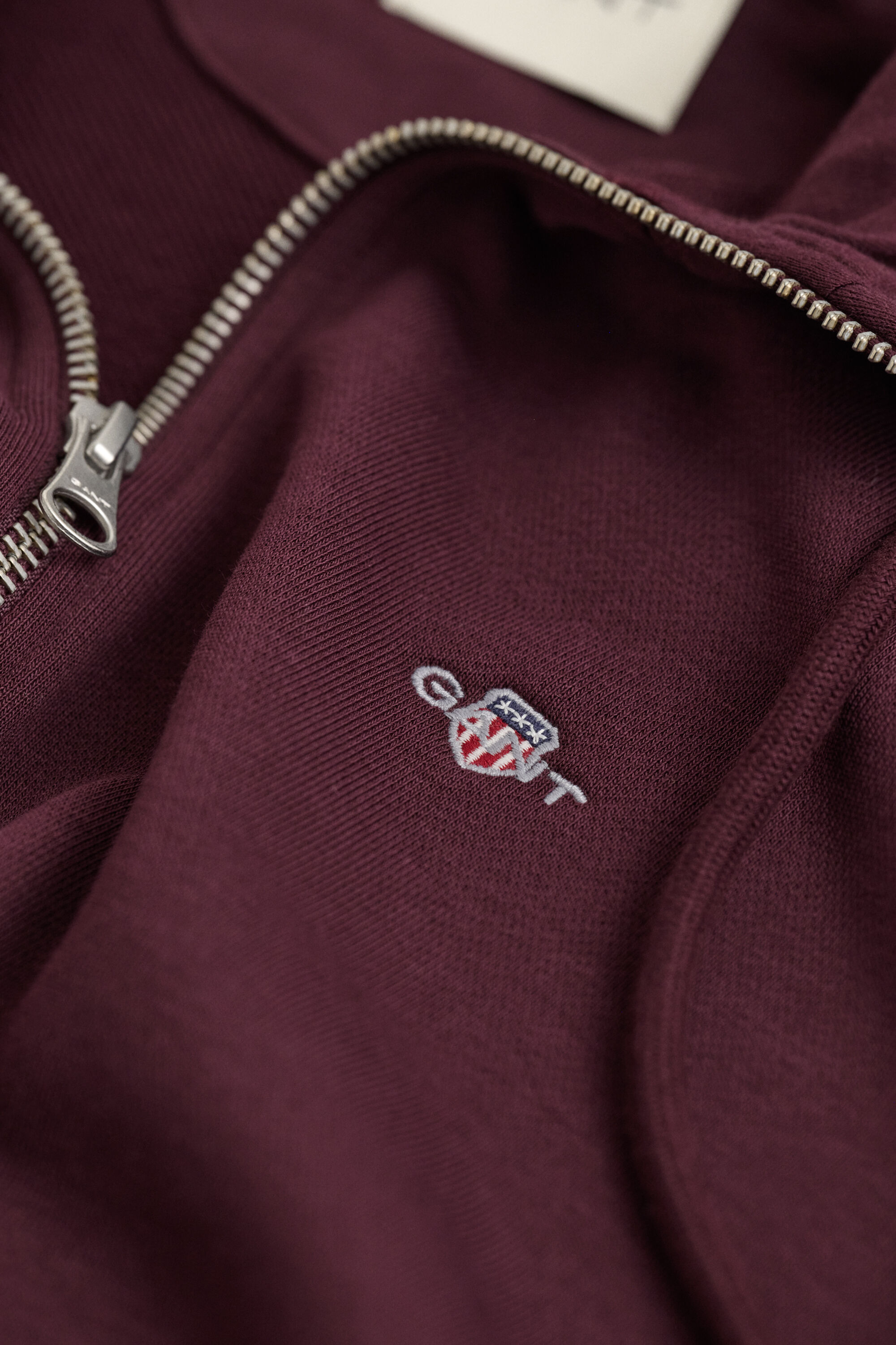 Sweat à capuche zippé avec écusson