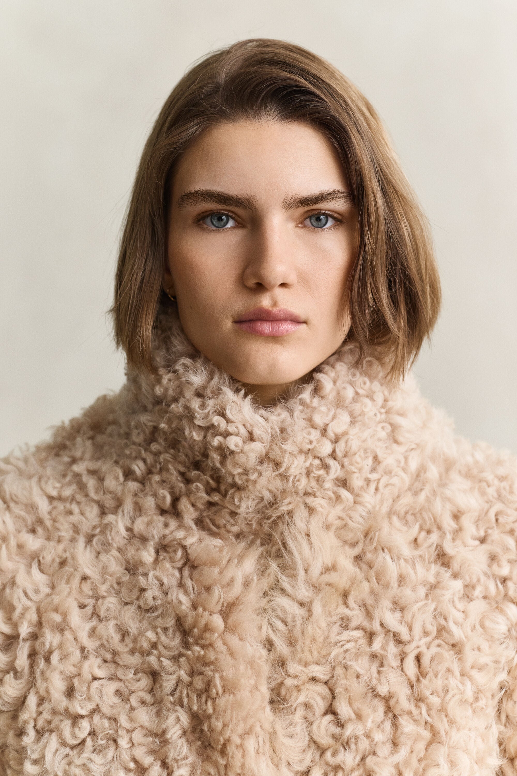 Manteau en peau lainée
