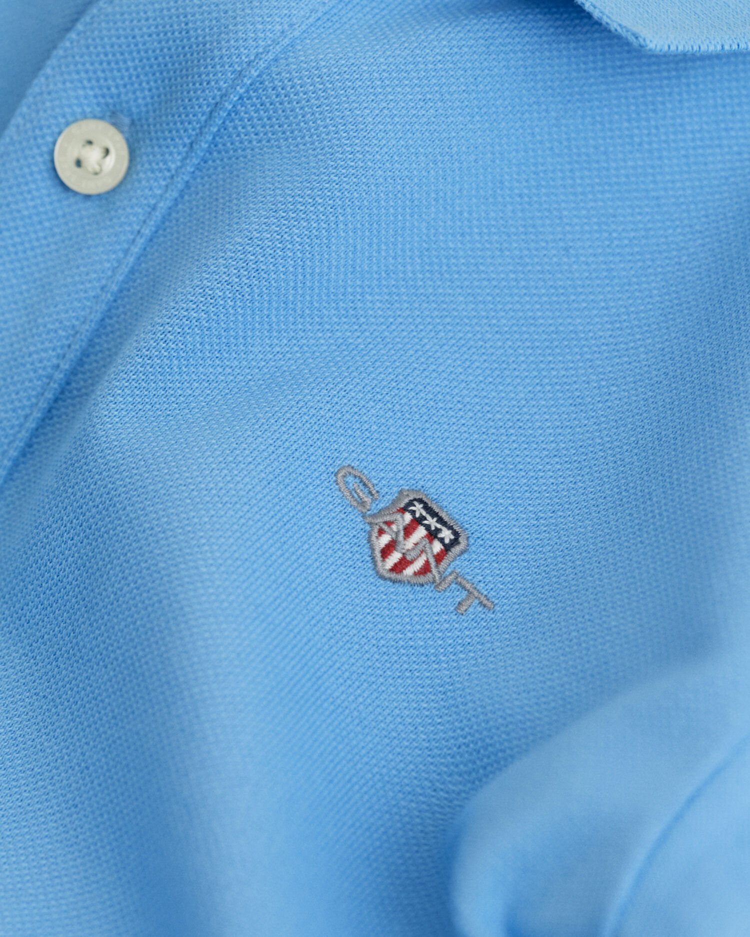 Polo en coton piqué à manches longues avec écusson Enfant