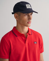 Polo en coton piqué avec col à rayures et liseré contrasté