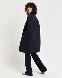 Manteau matelassé avec finitions en velours côtelé