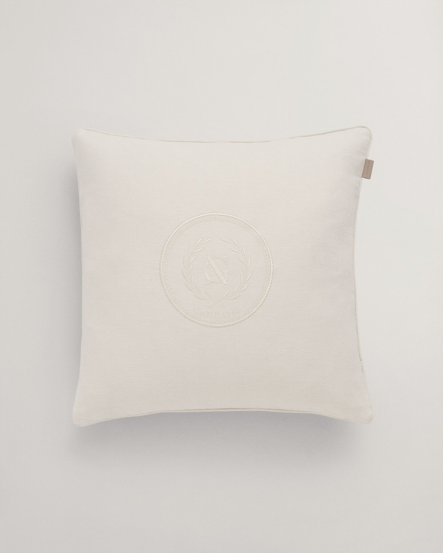 Housse de coussin Crest ton sur ton