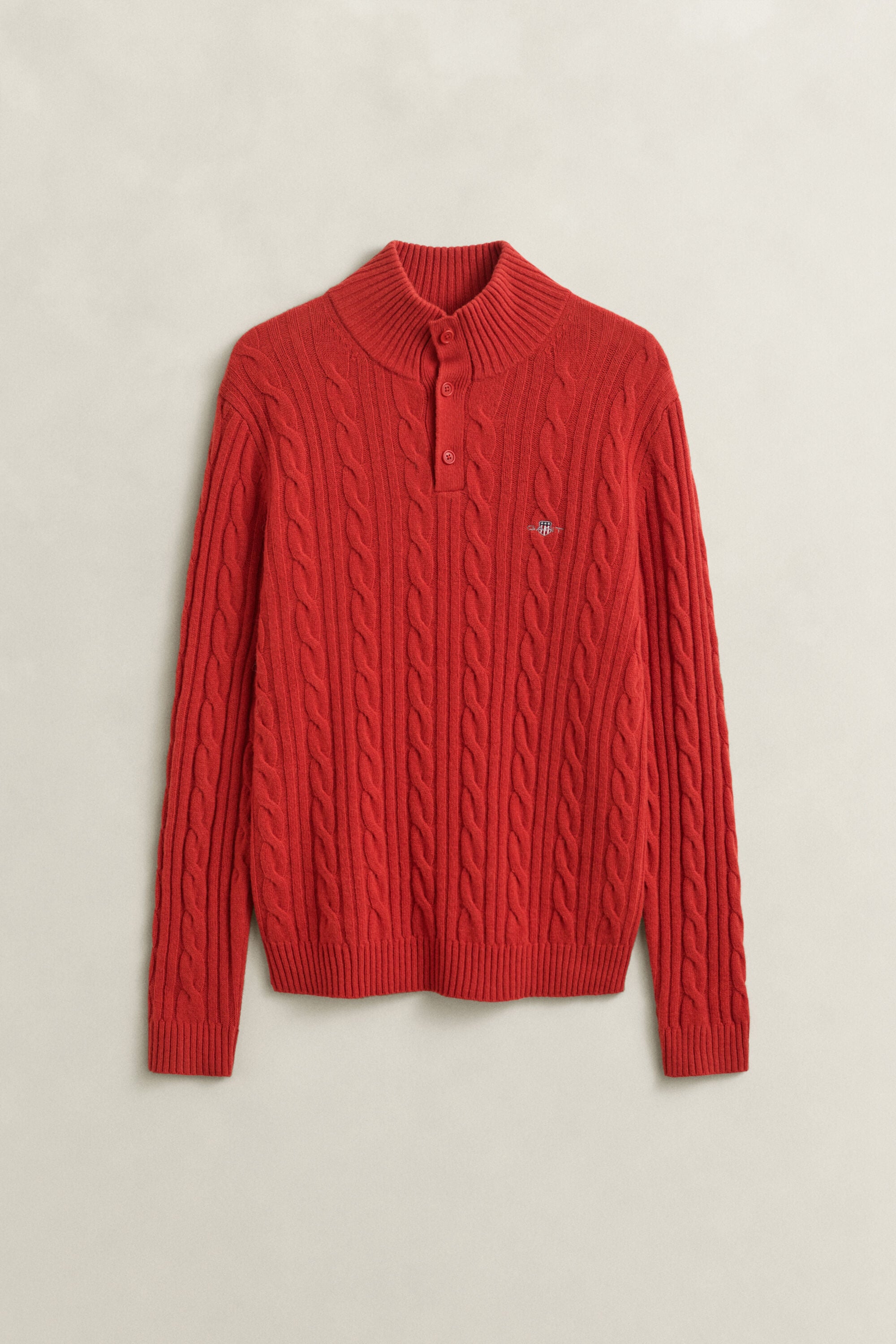 Pull semi-boutonné en laine d’agneau à maille torsadée