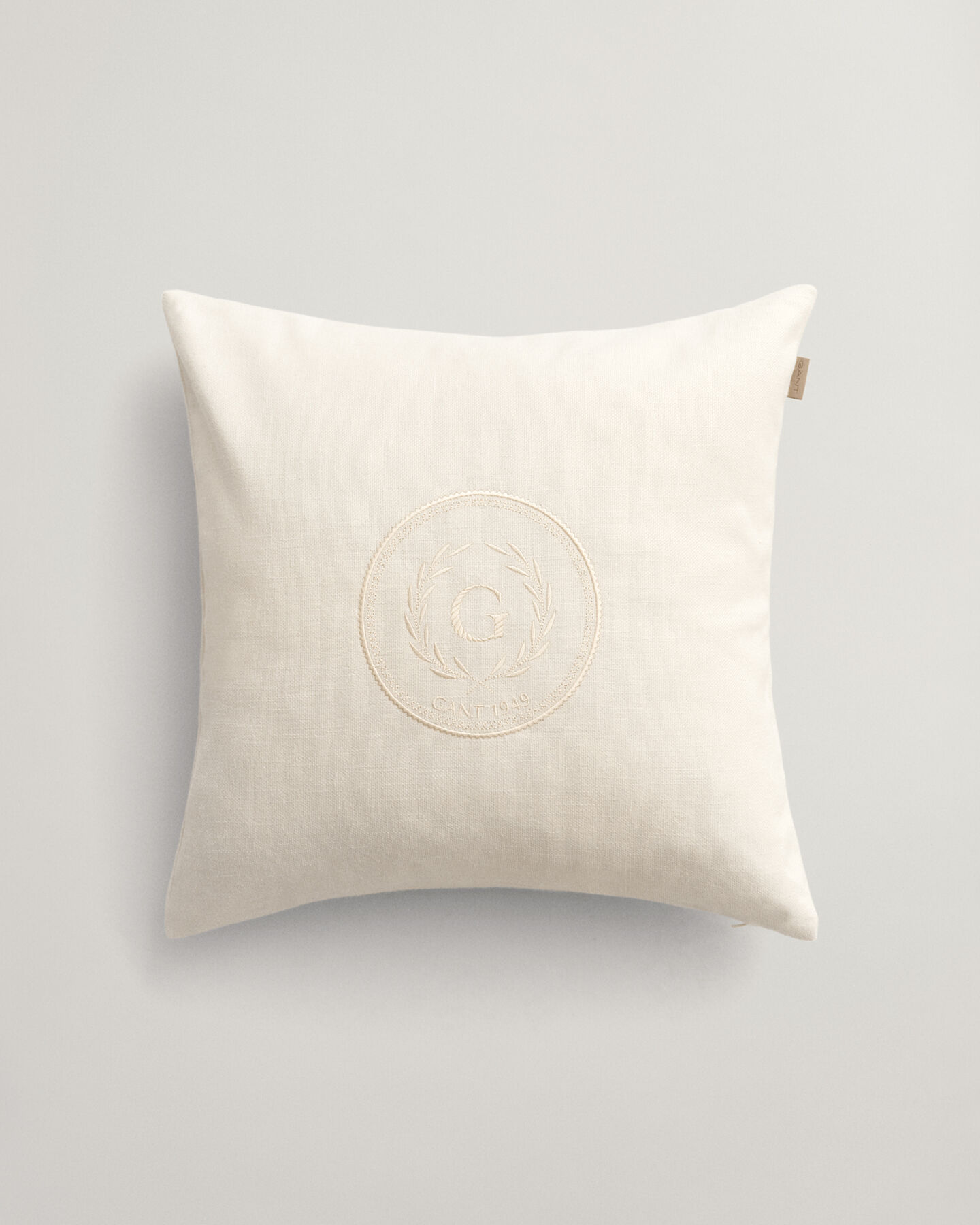 Housse de coussin Crest ton sur ton