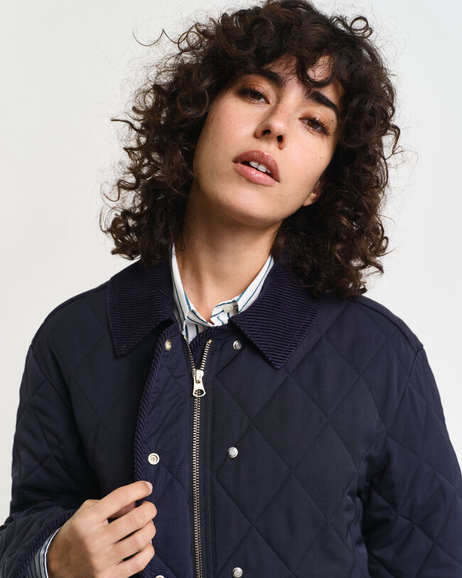 Manteau matelassé avec finitions en velours côtelé