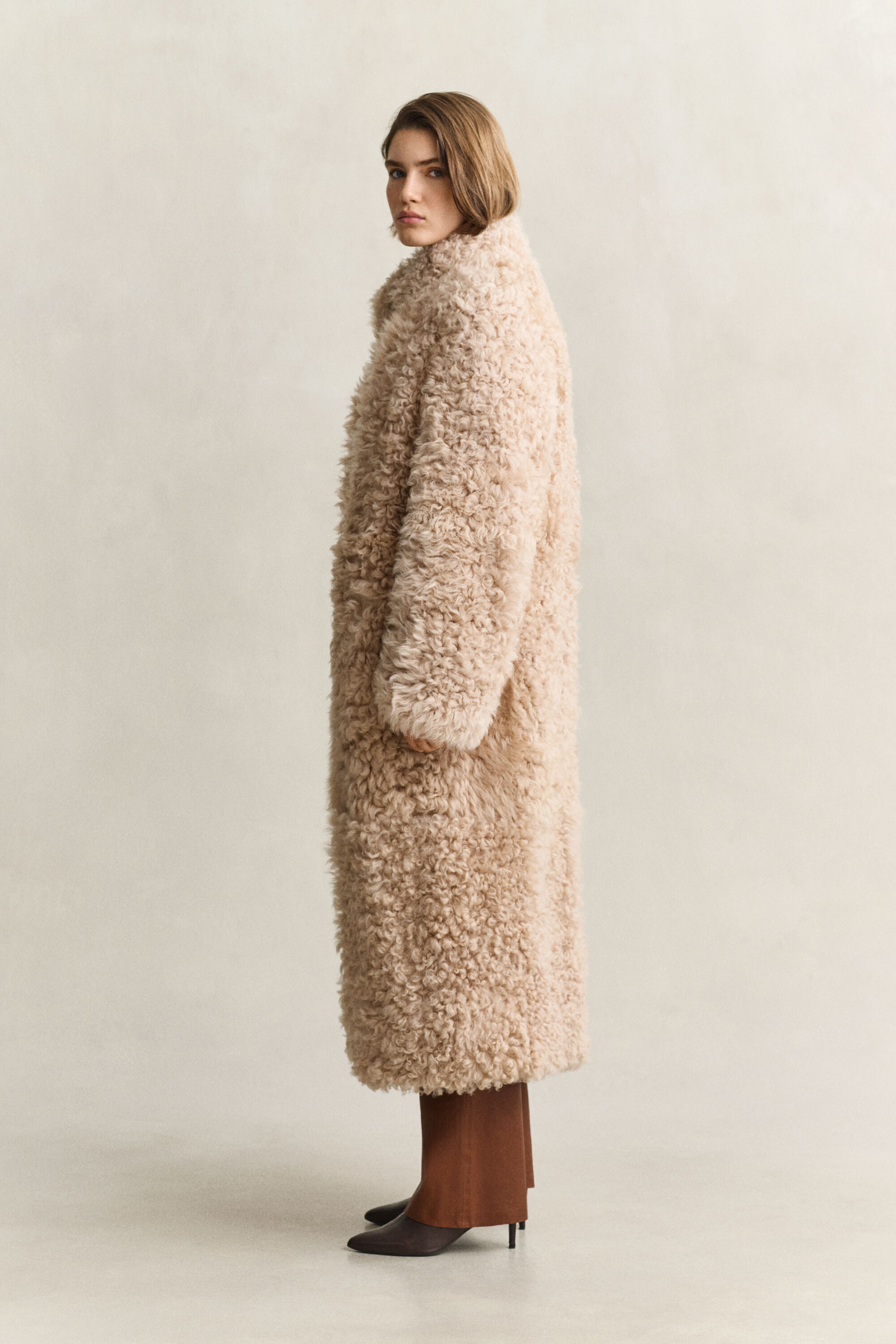 Manteau en peau lainée