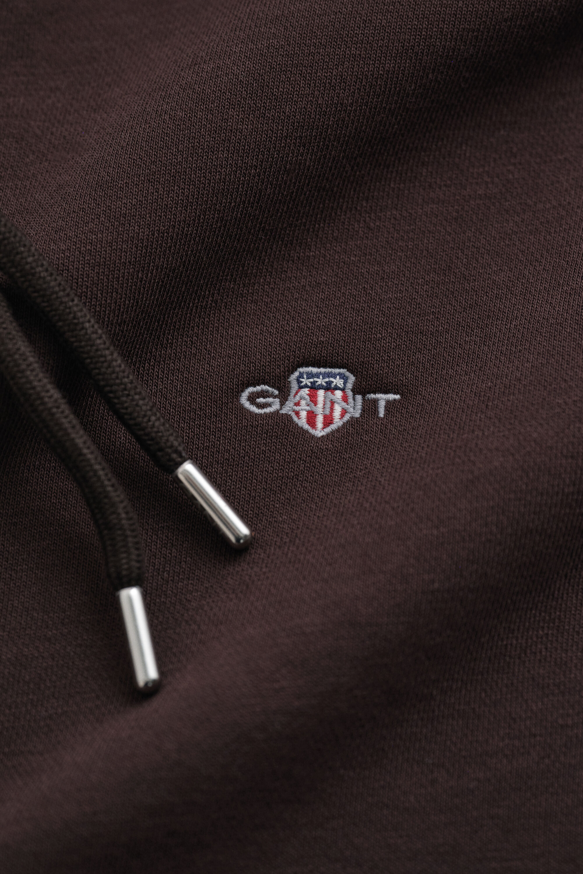 Sweat à capuche zippé avec écusson