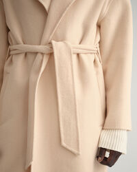 Manteau cousu main avec ceinture