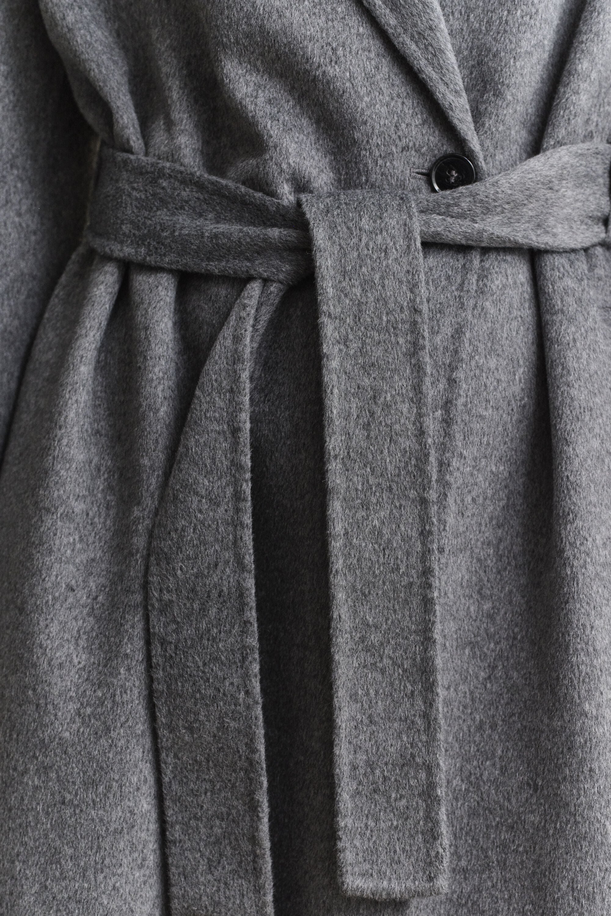 Manteau cousu main avec ceinture