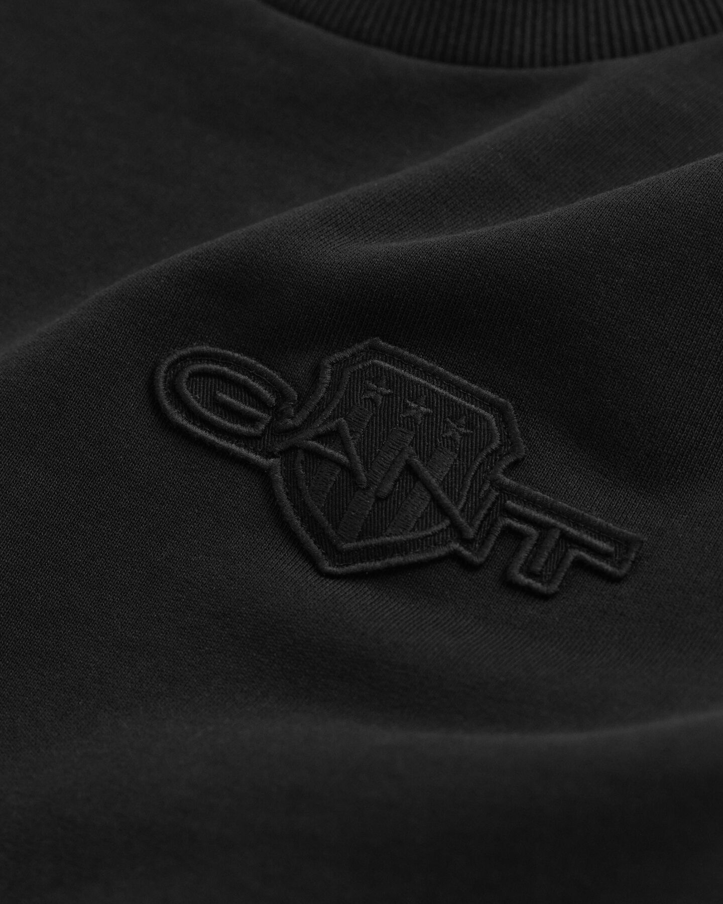 Sweat-shirt rond avec écusson ton sur ton