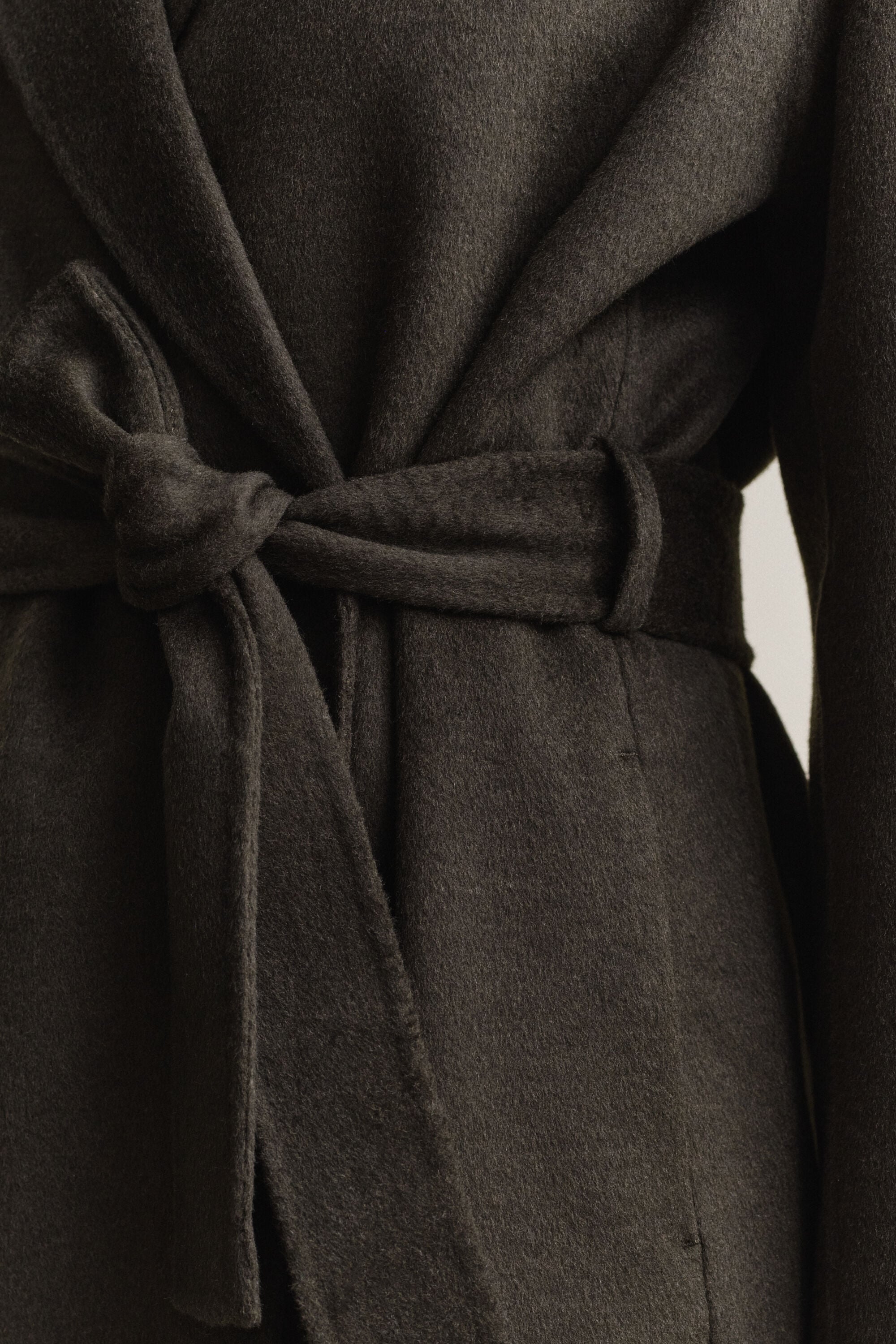 Manteau cousu main avec ceinture